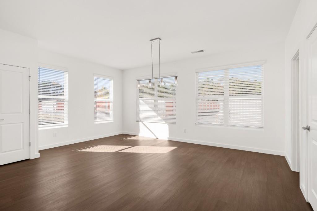 1078 Glen Opal Drive Decatur, GA 30032 - Photo 24 of 40 an empty room with wooden floor and windows