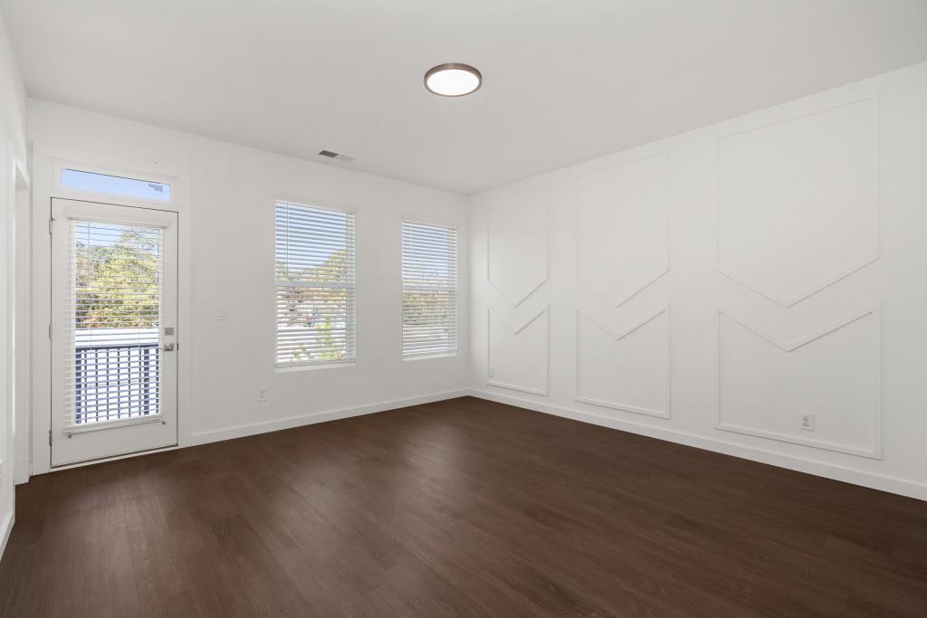 1078 Glen Opal Drive Decatur, GA 30032 - Photo 29 of 40 an empty room with wooden floor and windows