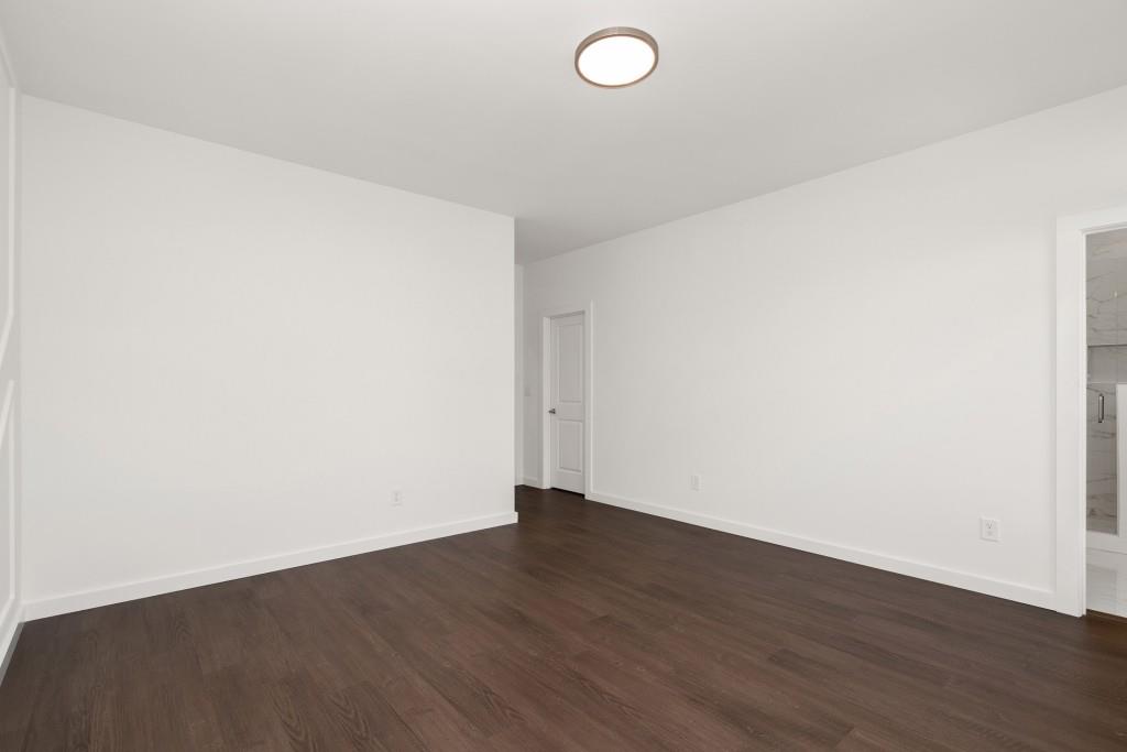 1078 Glen Opal Drive Decatur, GA 30032 - Photo 30 of 40 an empty room with wooden floor