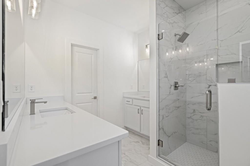 1078 Glen Opal Drive Decatur, GA 30032 - Photo 31 of 40 a bathroom with a shower and sink