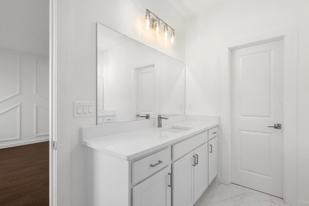 1078 Glen Opal Drive Decatur, GA 30032 - Photo 32 of 40 a bathroom with a sink and a mirror