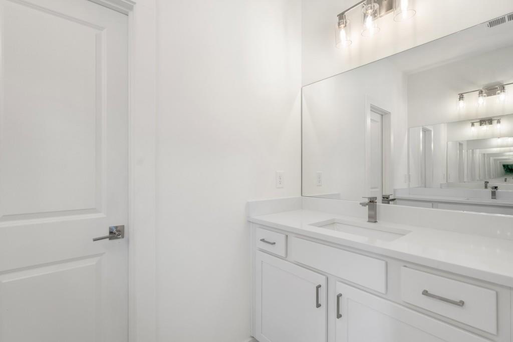 1078 Glen Opal Drive Decatur, GA 30032 - Photo 33 of 40 a bathroom with a sink and a mirror