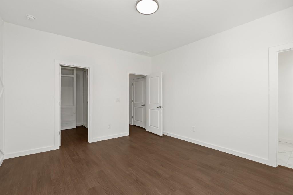 1078 Glen Opal Drive Decatur, GA 30032 - Photo 39 of 40 a view of an empty room with wooden floor and closet