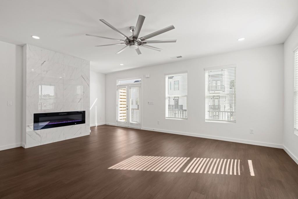 1078 Glen Opal Drive Decatur, GA 30032 - Photo 8 of 40 a view of an empty room with window and wooden floor
