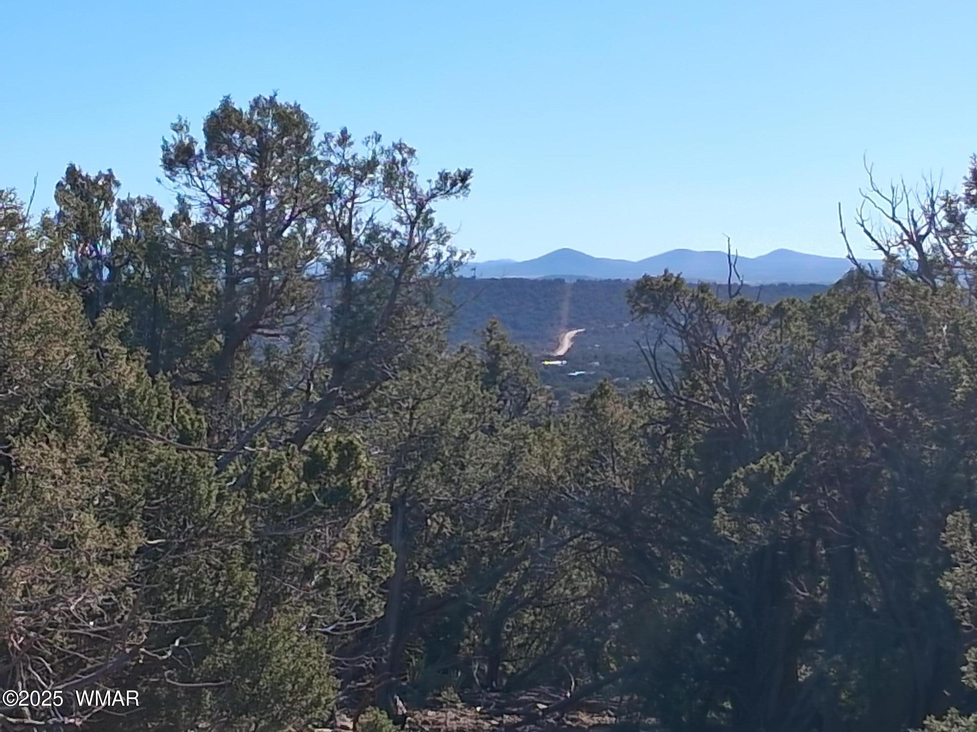 3 North 8716th Concho, AZ 85924 - Photo 1 of 11 a view of a city with a mountain in the background
