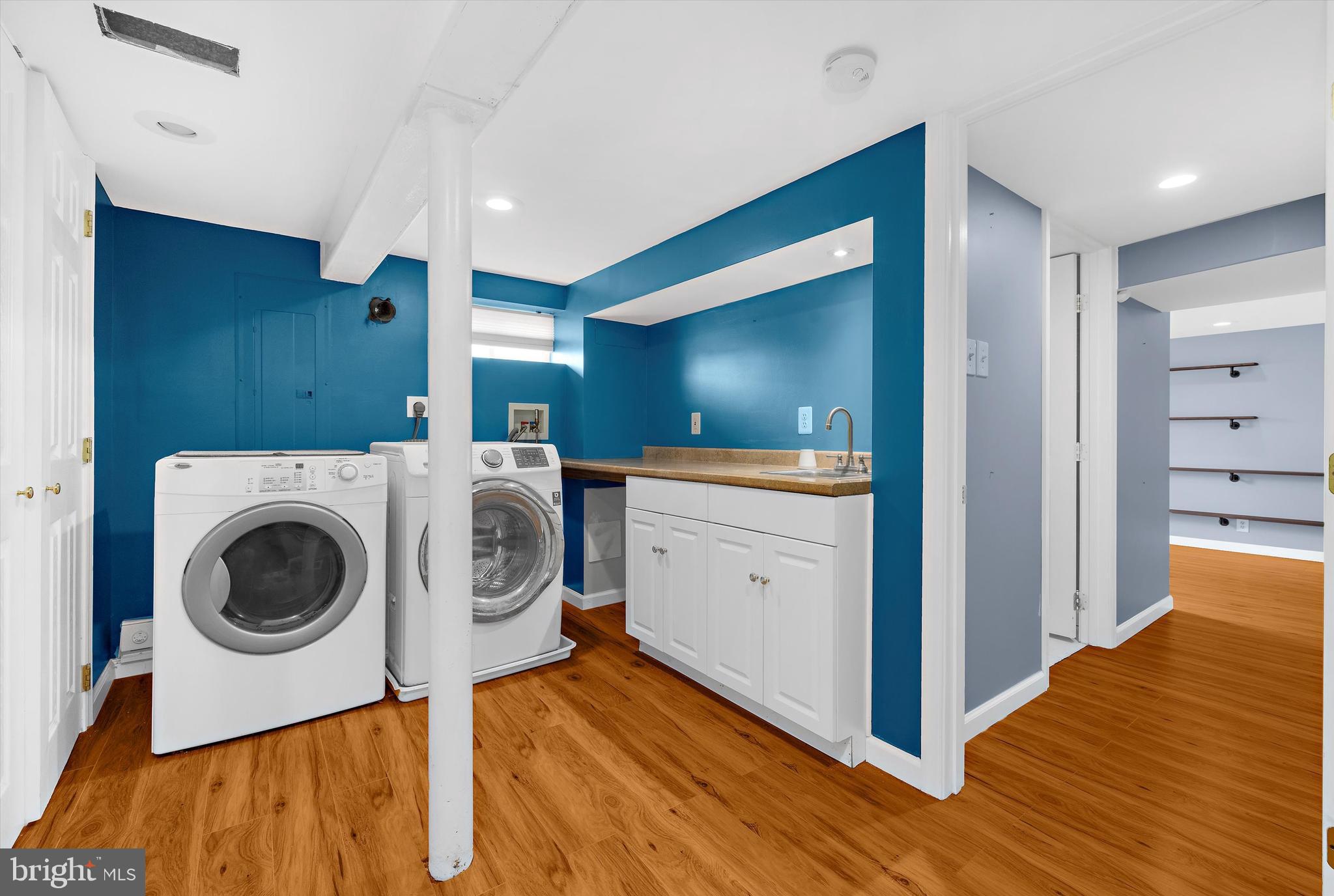 8464 Geneva Road Pasadena, MD 21122 - Photo 21 of 59 a view of a hallway with washer and dryer
