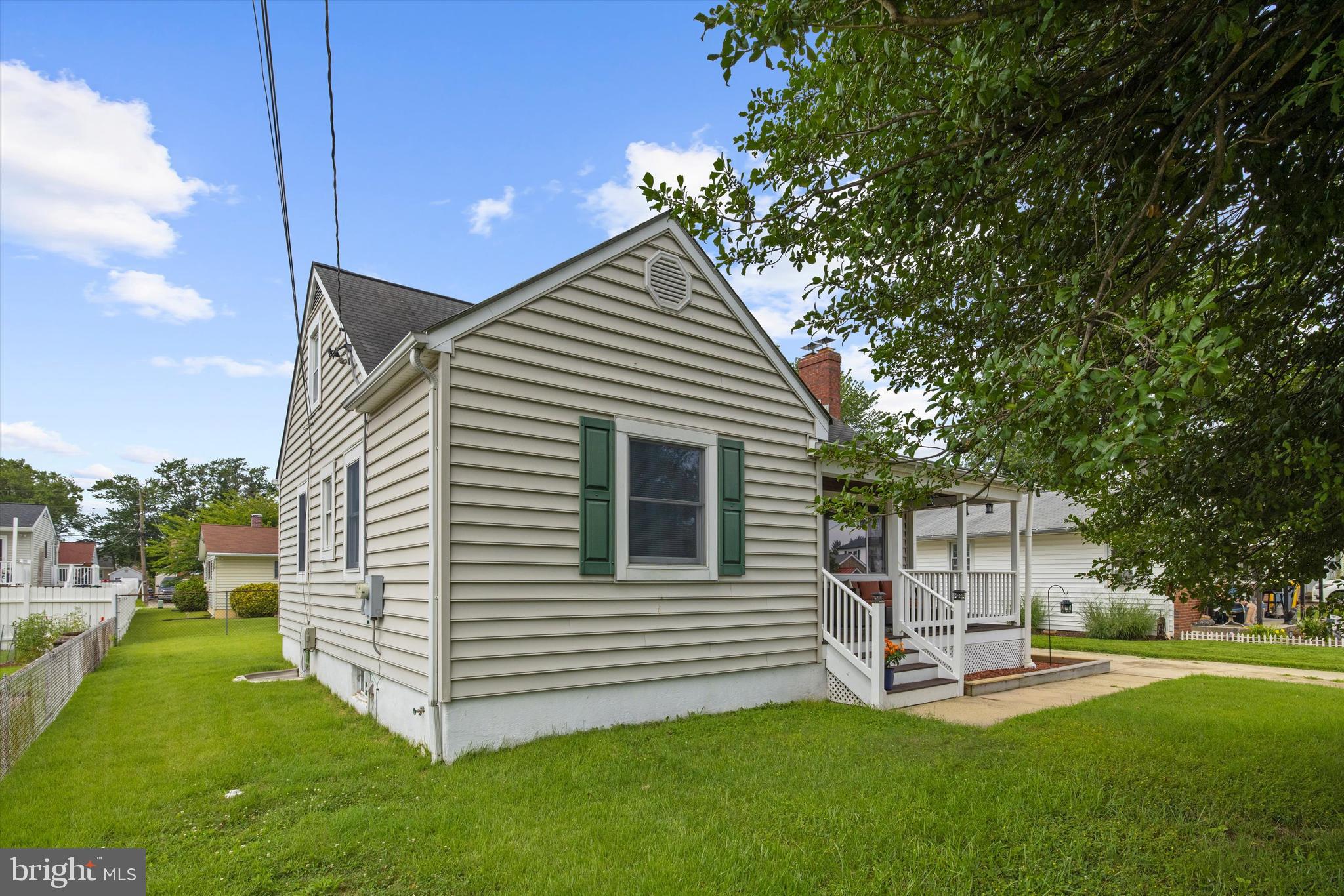 8464 Geneva Road Pasadena, MD 21122 - Photo 3 of 59 a view of a house with a yard and sitting area