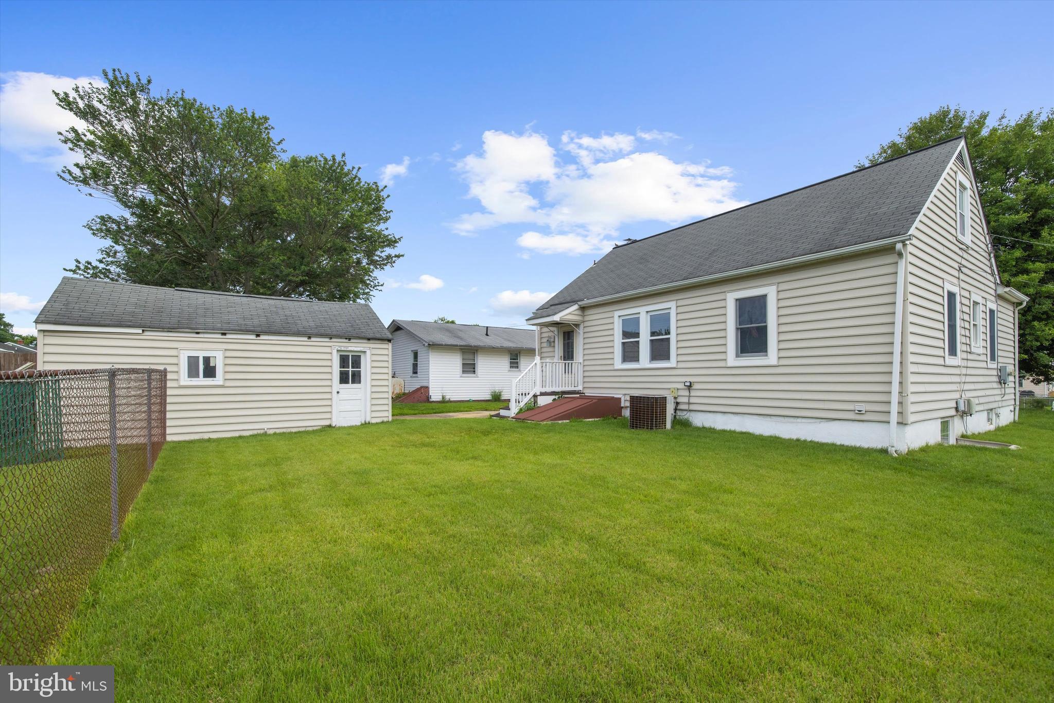 8464 Geneva Road Pasadena, MD 21122 - Photo 36 of 59 a view of a backyard with plants and a garden