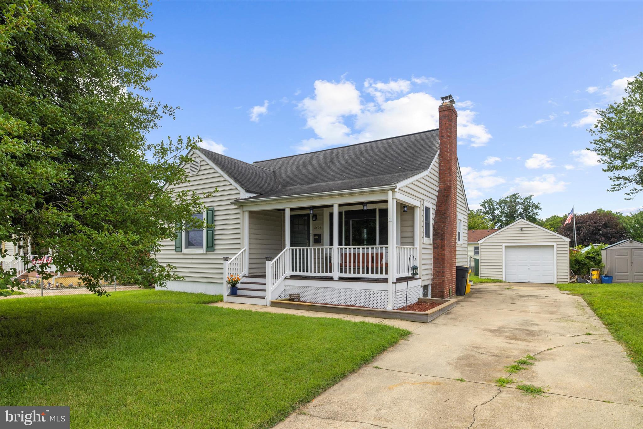 8464 Geneva Road Pasadena, MD 21122 - Photo 39 of 59 a front view of a house with garden