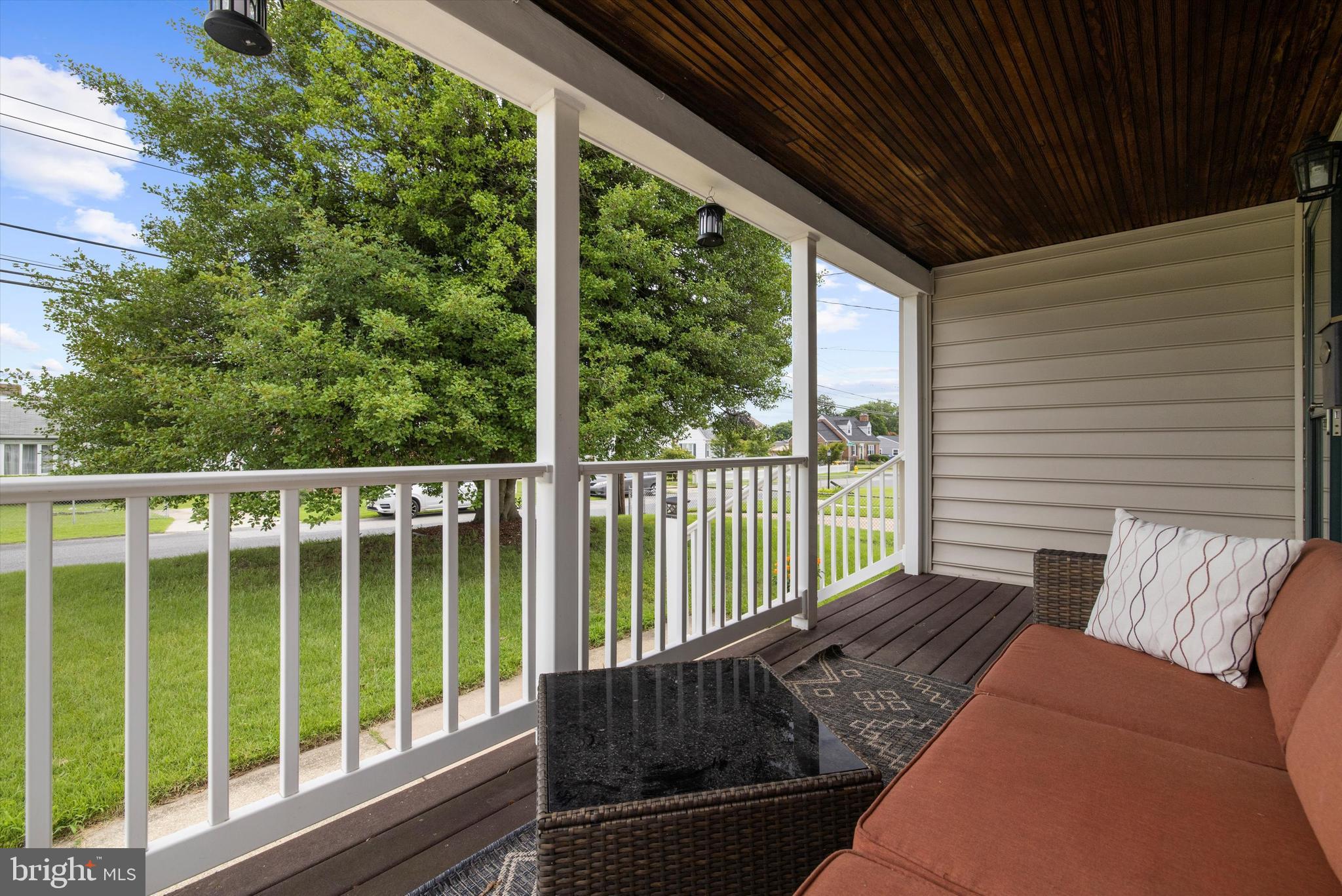 8464 Geneva Road Pasadena, MD 21122 - Photo 4 of 59 a balcony with wooden floor in outdoor space