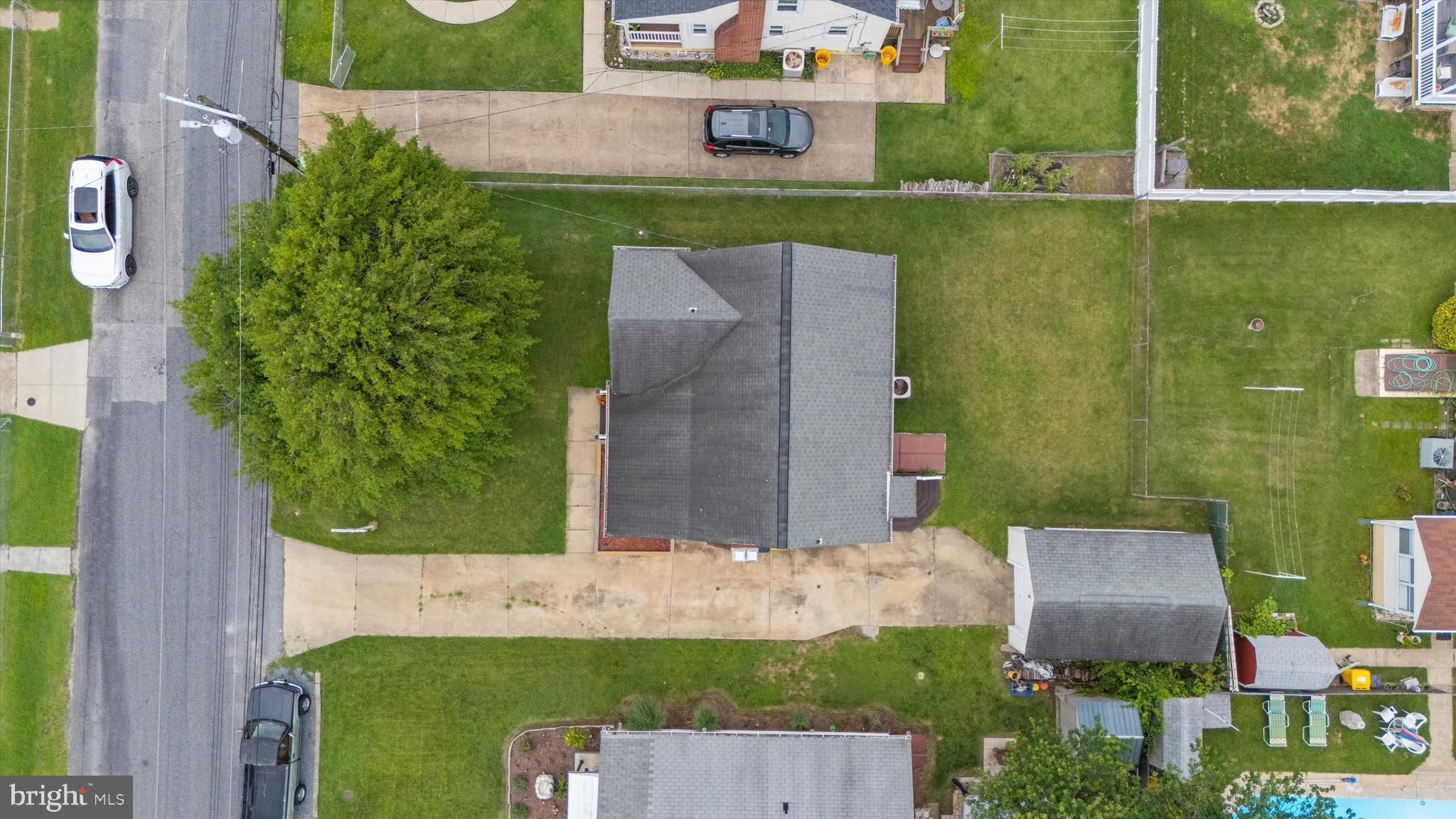 8464 Geneva Road Pasadena, MD 21122 - Photo 42 of 59 an aerial view of a house with a garden and yard