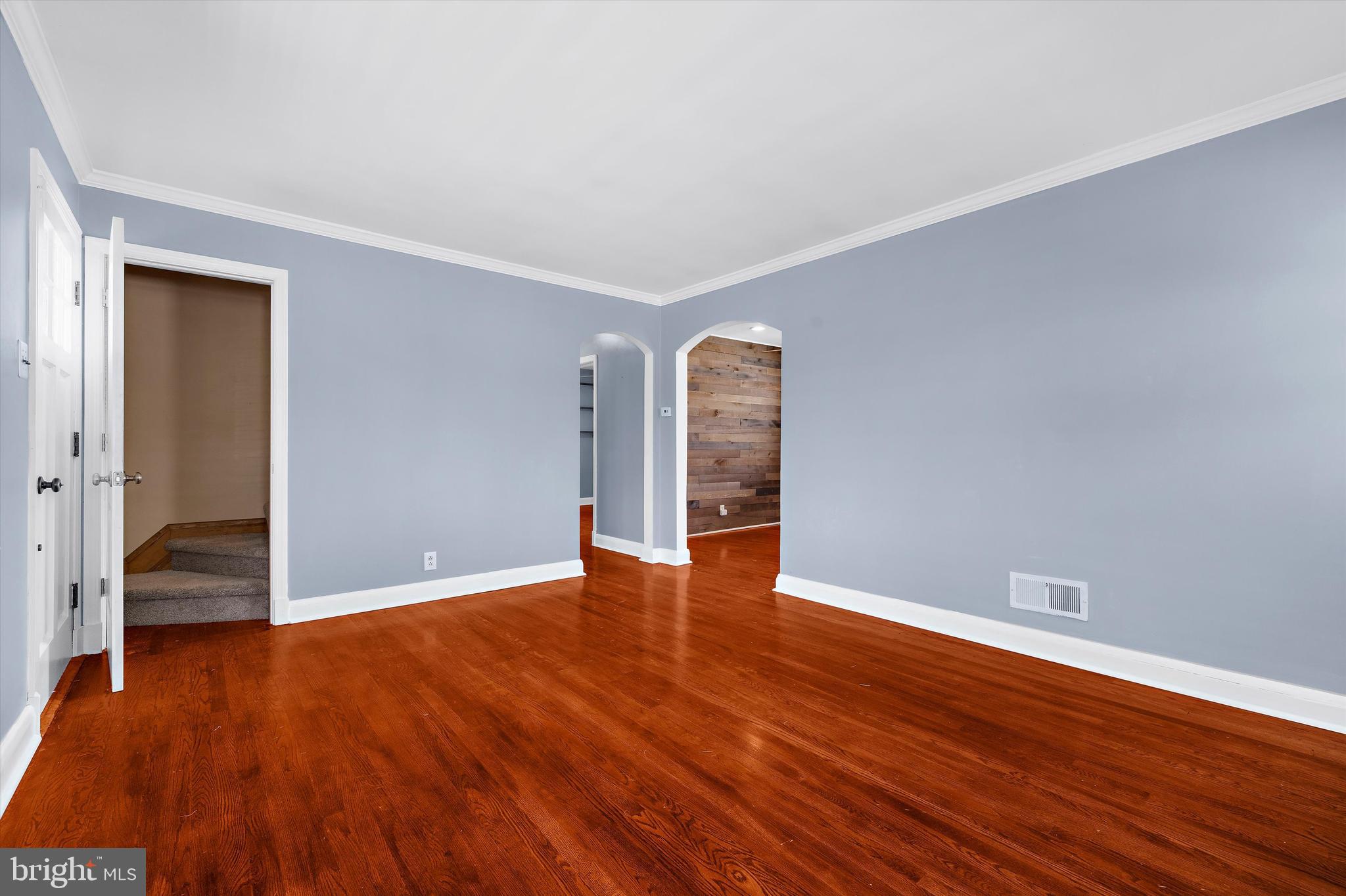 8464 Geneva Road Pasadena, MD 21122 - Photo 7 of 59 a view of empty room with wooden floor