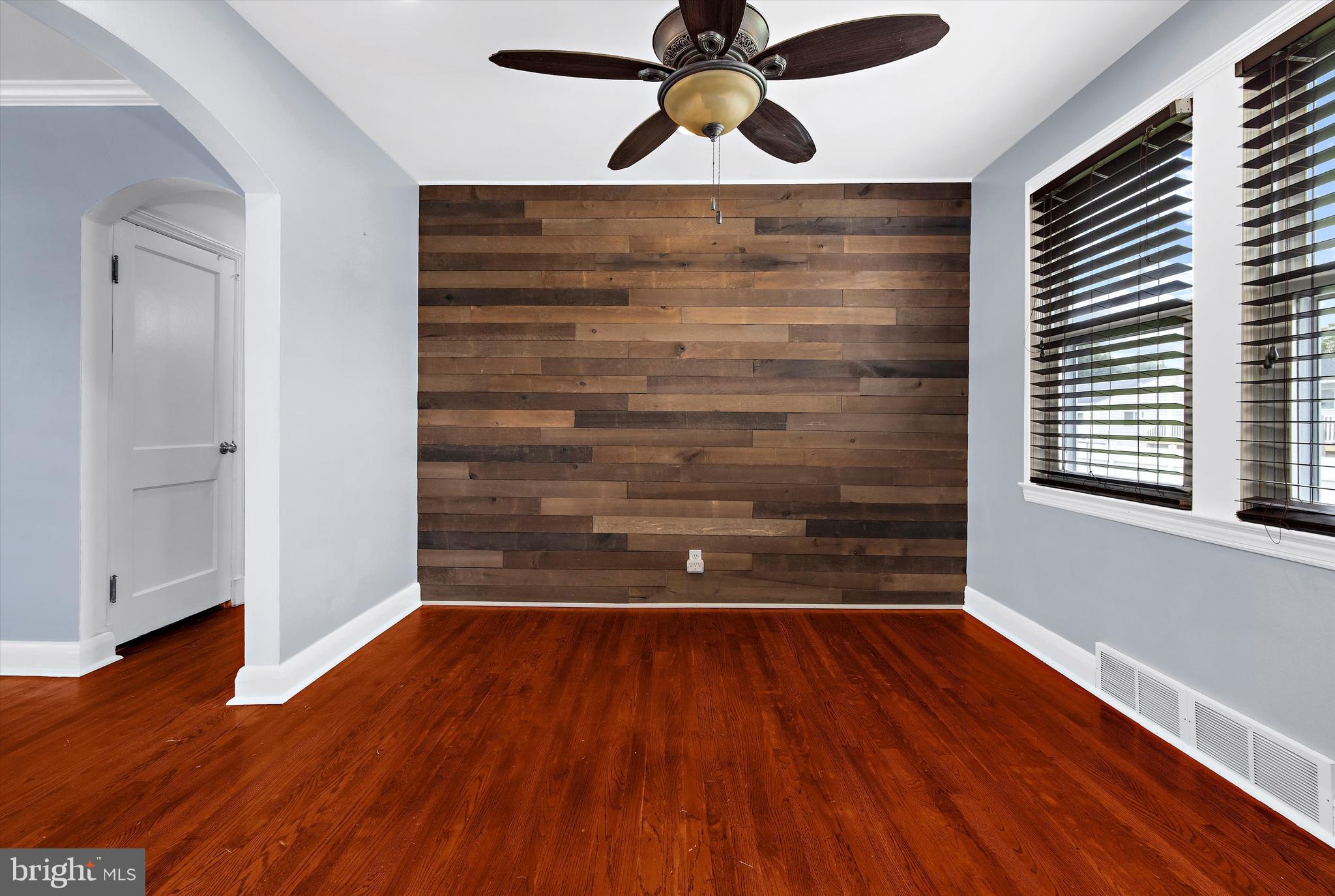 8464 Geneva Road Pasadena, MD 21122 - Photo 9 of 59 a view of room with wooden floor and window