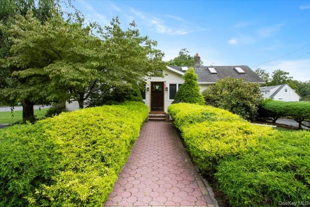 a view of house with garden