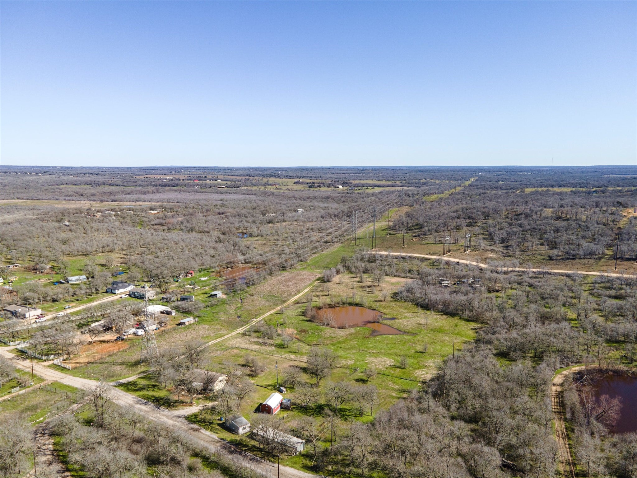 175 Settlers Trail Elgin, TX 78621 - Photo 1 of 1 Nestled on 6.442 sprawling acres, this single-level home offers a harmonious blend of rural tranquility & modern comfort.