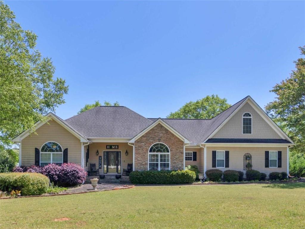 105 Godsey Road Jackson, GA 30233 - Photo 1 of 1 a front view of house with yard and green space