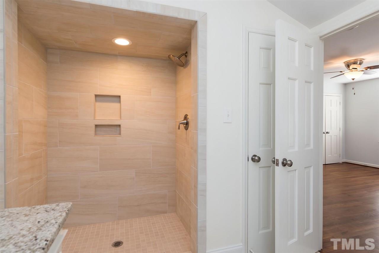 5828 Morning Forest Drive Raleigh, NC 27609 - Photo 18 of 25 a bathroom with a shower
