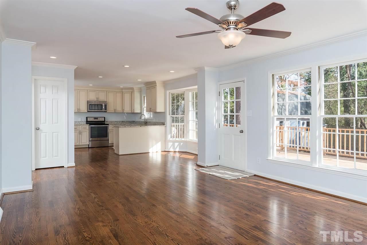 5828 Morning Forest Drive Raleigh, NC 27609 - Photo 8 of 25 a view of a kitchen with wooden floor and a kitchen