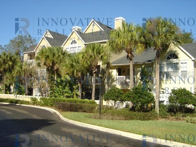 1021 South Hiawassee Road, Unit 3922 Orlando, FL 32835 - Photo 1 of 1 a front view of a house with garden