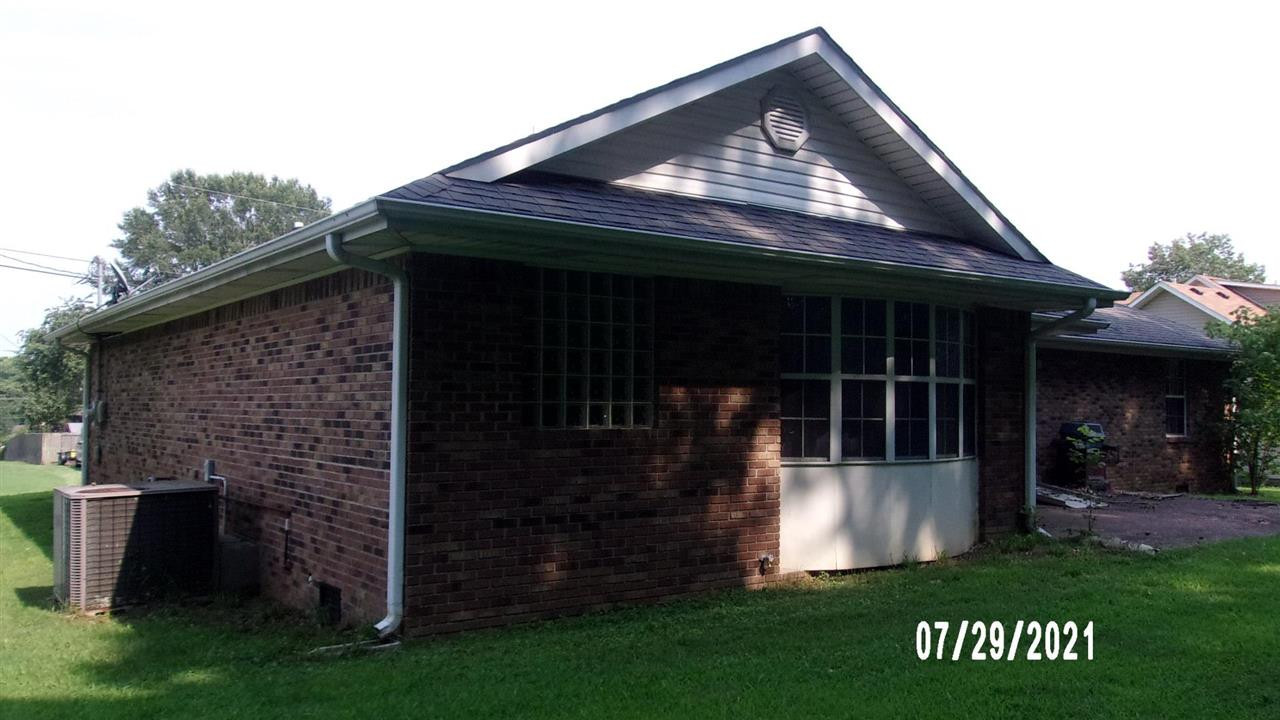 301 Jordan Street Ripley, TN 38063 - Photo 4 of 19 a front view of a house with garden