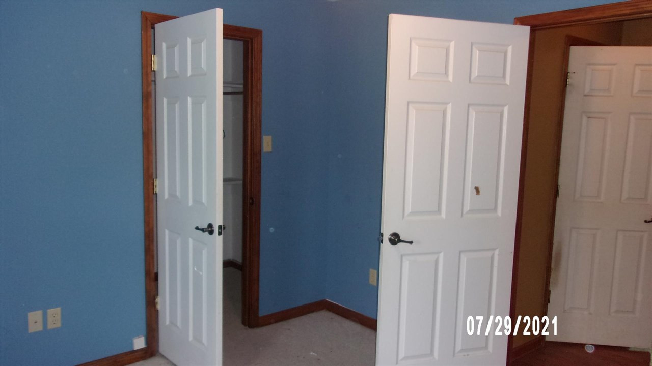 301 Jordan Street Ripley, TN 38063 - Photo 9 of 19 a view of a hallway with wooden floor