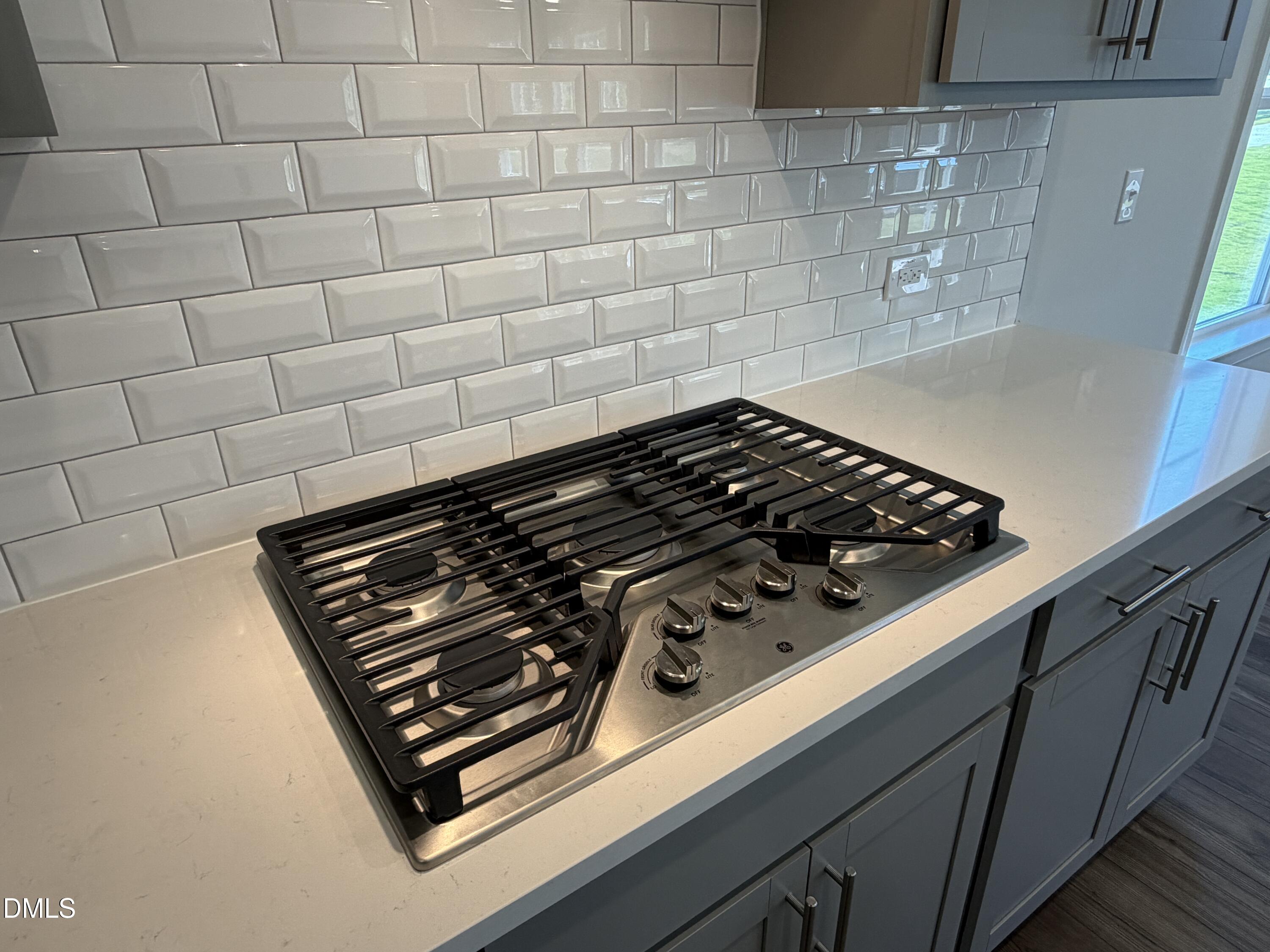 3016 Sandy Bluff Road Raleigh, NC 27616 - Photo 10 of 34 a close up of a stove top oven sitting inside of a kitchen