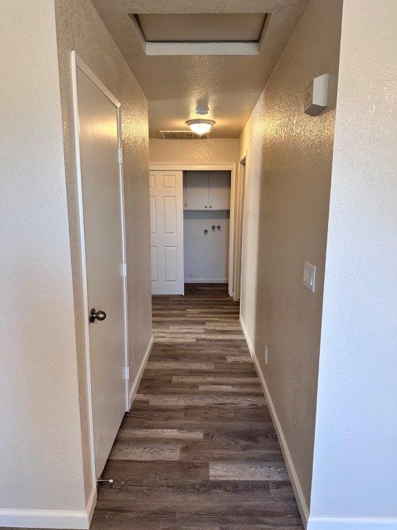 1405 East Cypress Avenue Reedley, CA 93654 - Photo 27 of 29 a view of a hallway with wooden floor