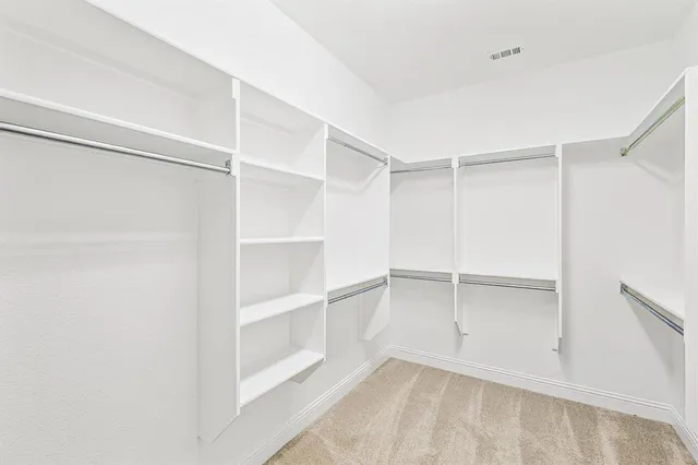 a view of an empty walk in closet