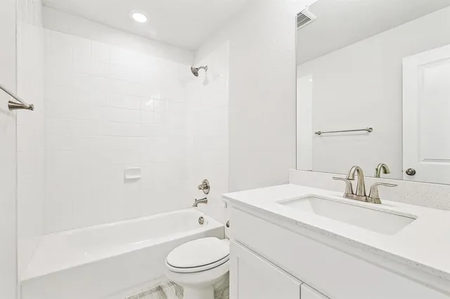a bathroom with a sink toilet and a bathtub