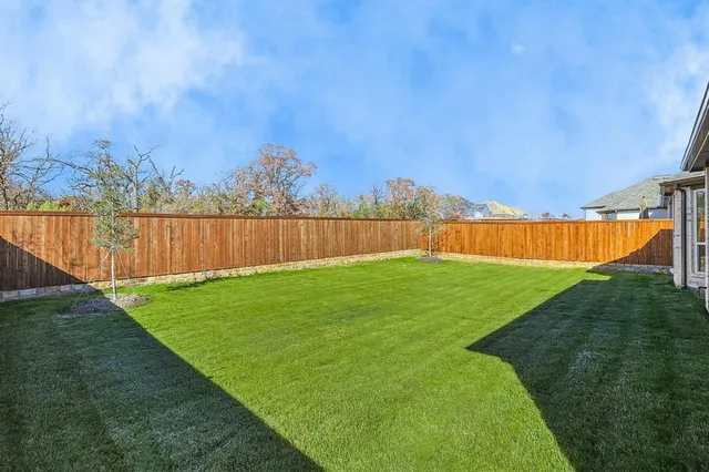 a view of a backyard with green space