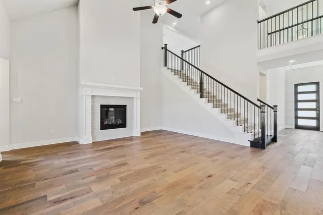 a view of an empty room with a fireplace