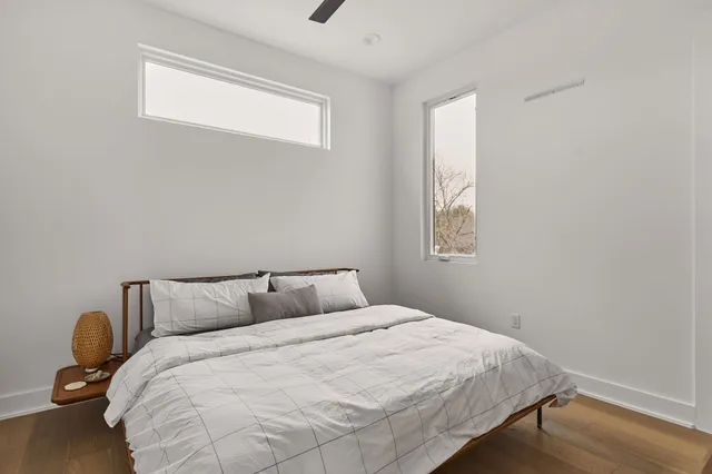 a bedroom with a bed and window