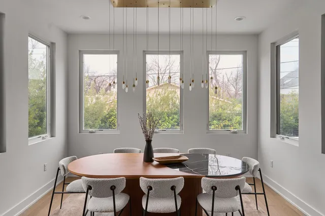 a dining room with furniture and window
