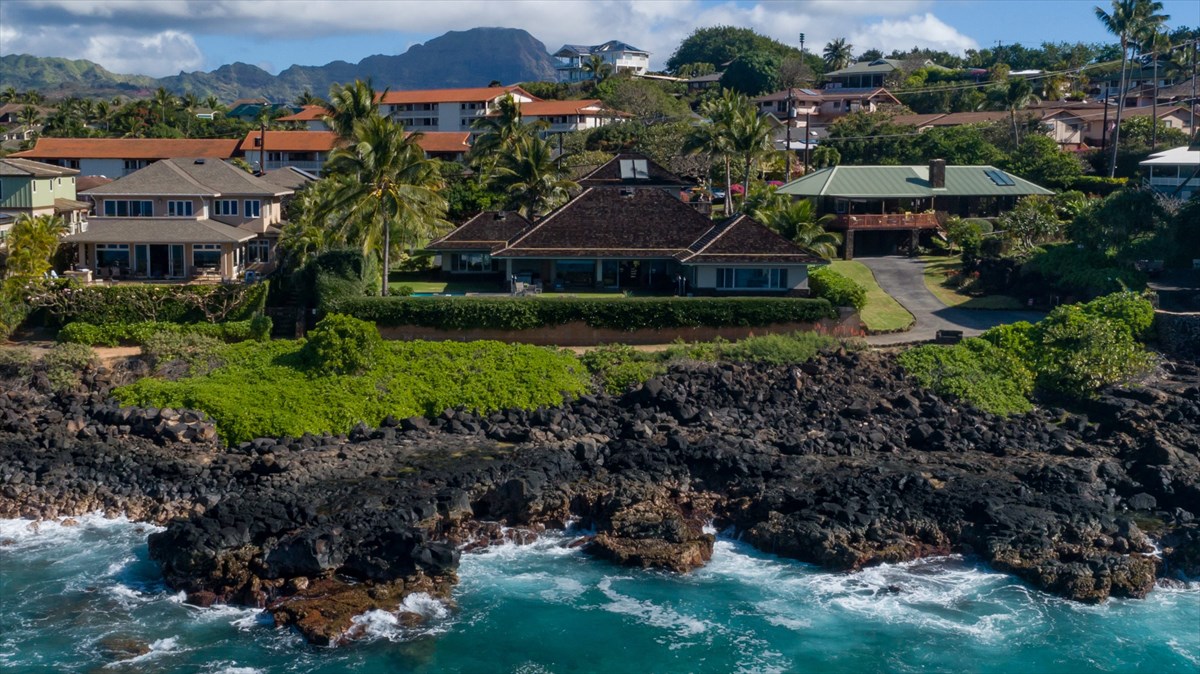 a view of a garden with a house