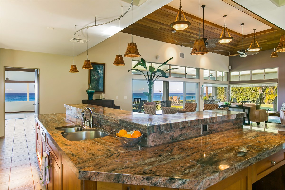 1811 Pe'e Road Koloa, HI 96756 - Photo 10 of 25 a kitchen with stainless steel appliances granite countertop a sink and cabinets
