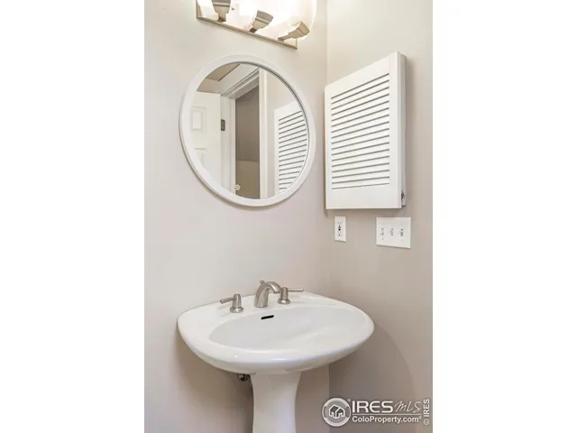 a bedroom with a bed and cabinets