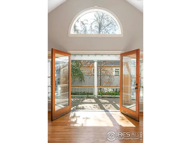 a living room with a furniture and a fireplace
