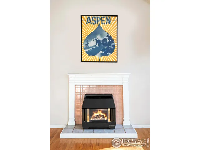 a view of an empty room with a fireplace