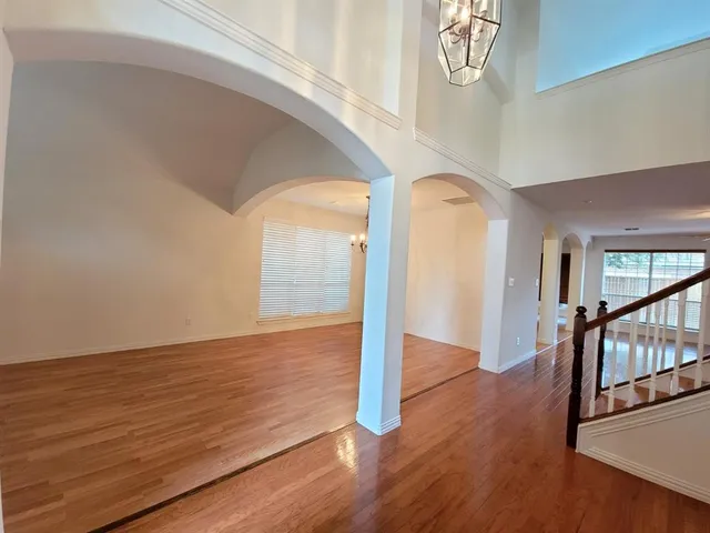 a view of an entryway with wooden floor