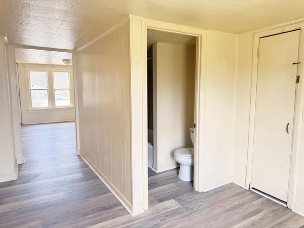 a bathroom with a toilet and a shower