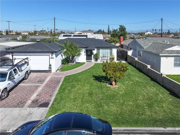 a aerial view of a house with a garden and plants