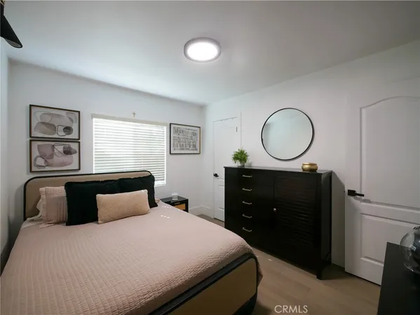 a bedroom with a bed and a dresser