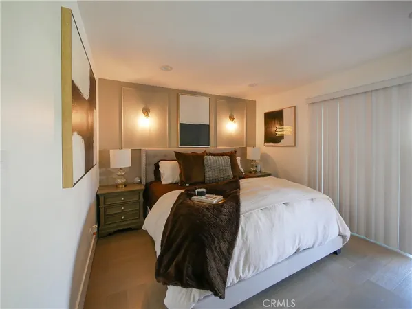 a bed room with a bed and a night stand