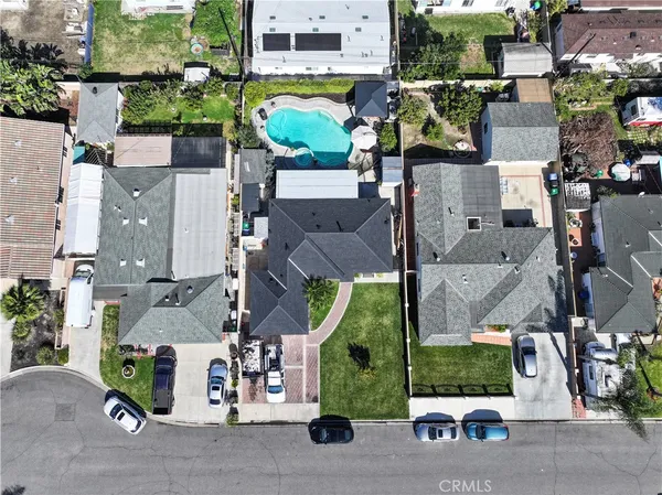 an aerial view of multiple houses with outdoor space