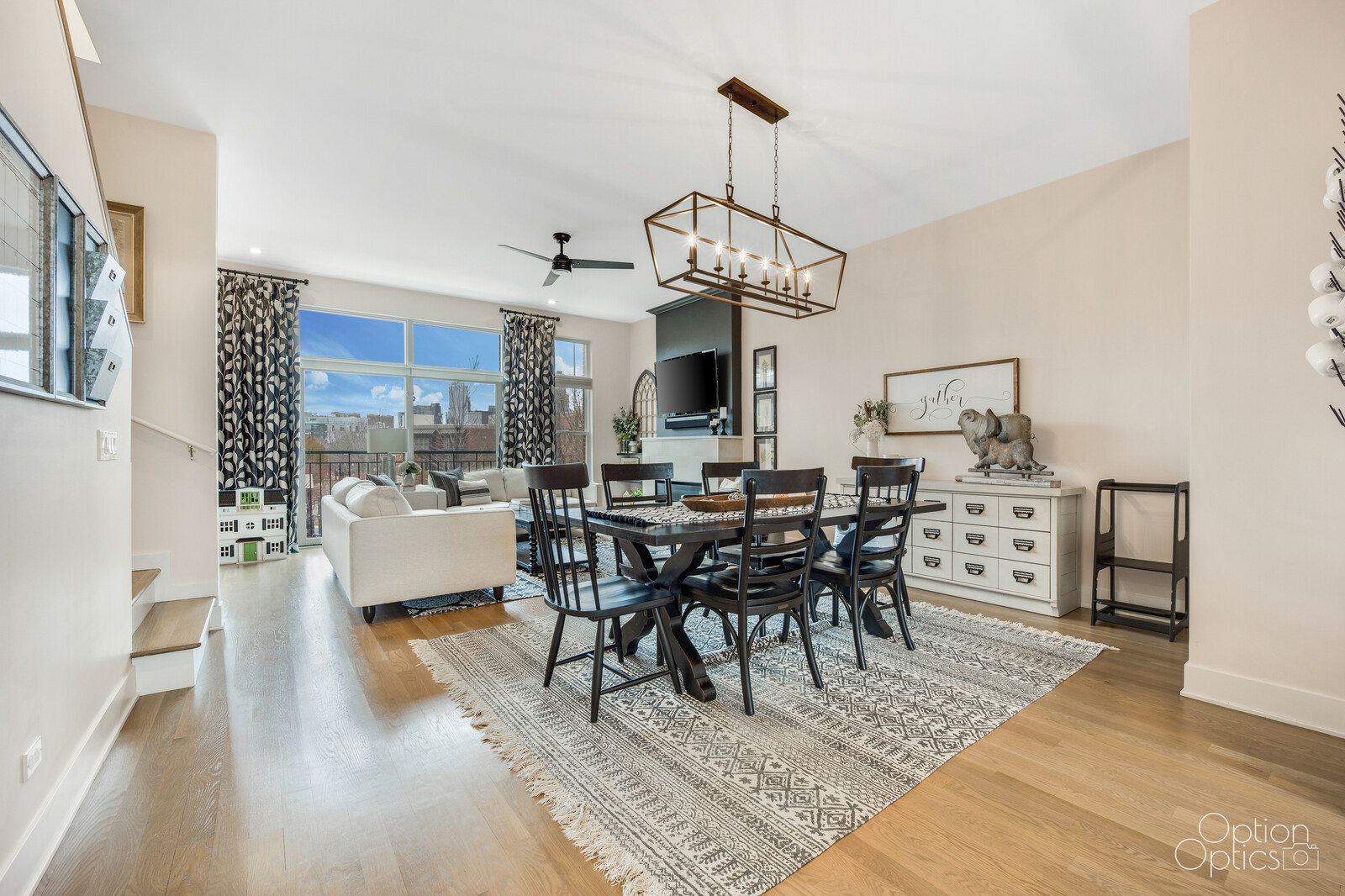 733 West 15th Street Chicago, IL 60607 - Photo 11 of 34 a view of a dining room and livingroom with furniture wooden floor a chandelier and a rug