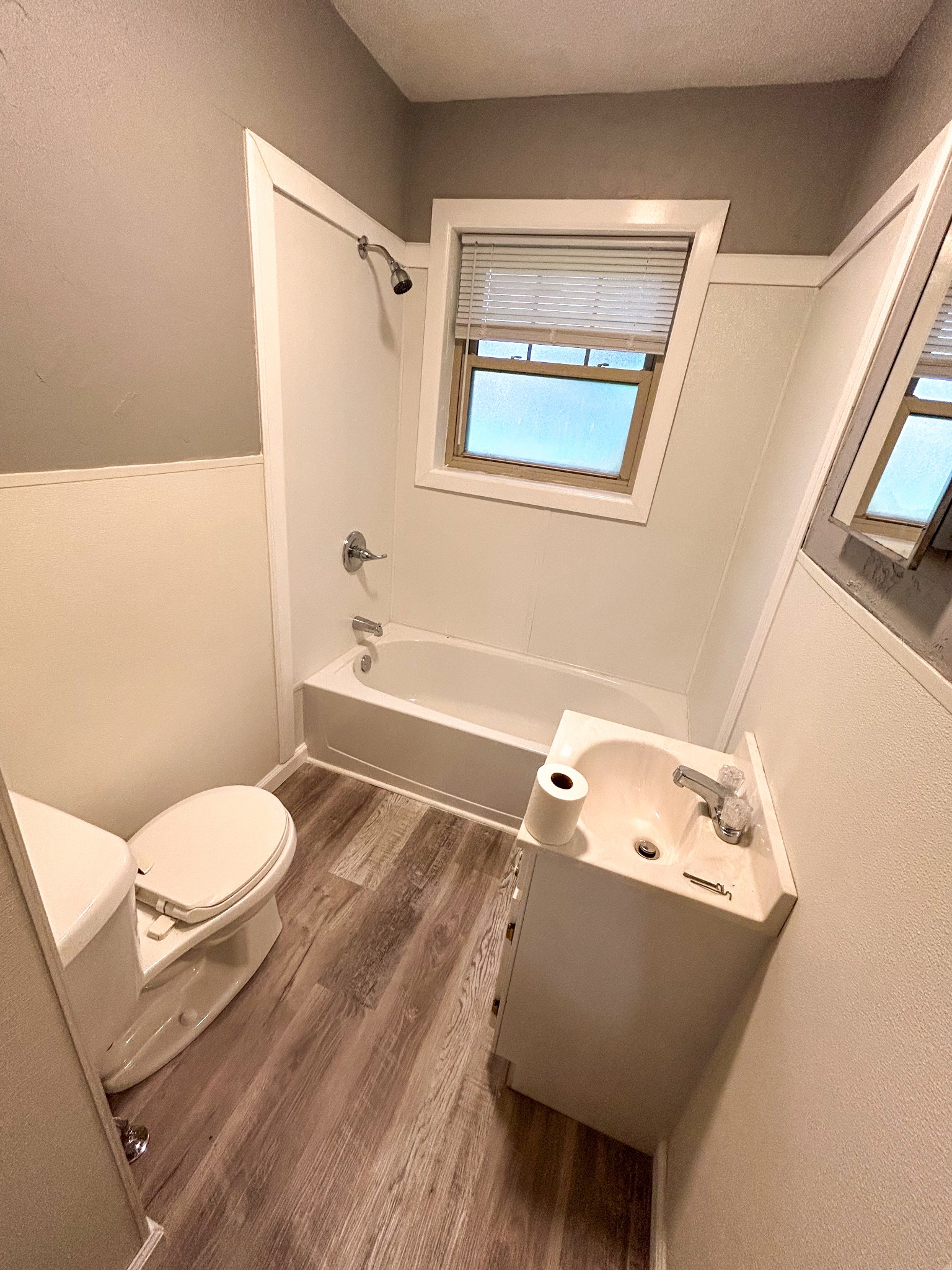 181 Jones Street Huntingdon, TN 38344 - Photo 18 of 21 a bathroom with a toilet sink and mirror