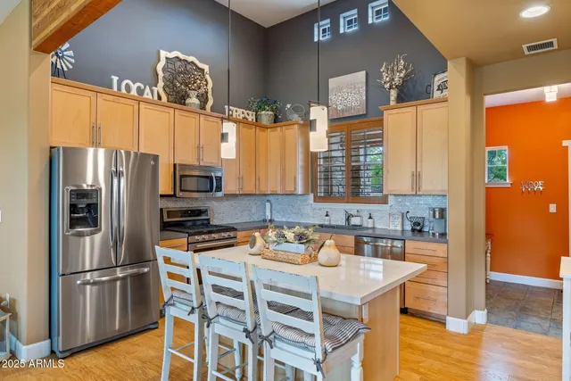 a dining room with furniture a window and chandelier