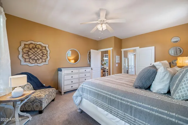 a spacious bedroom with a bed and a couch