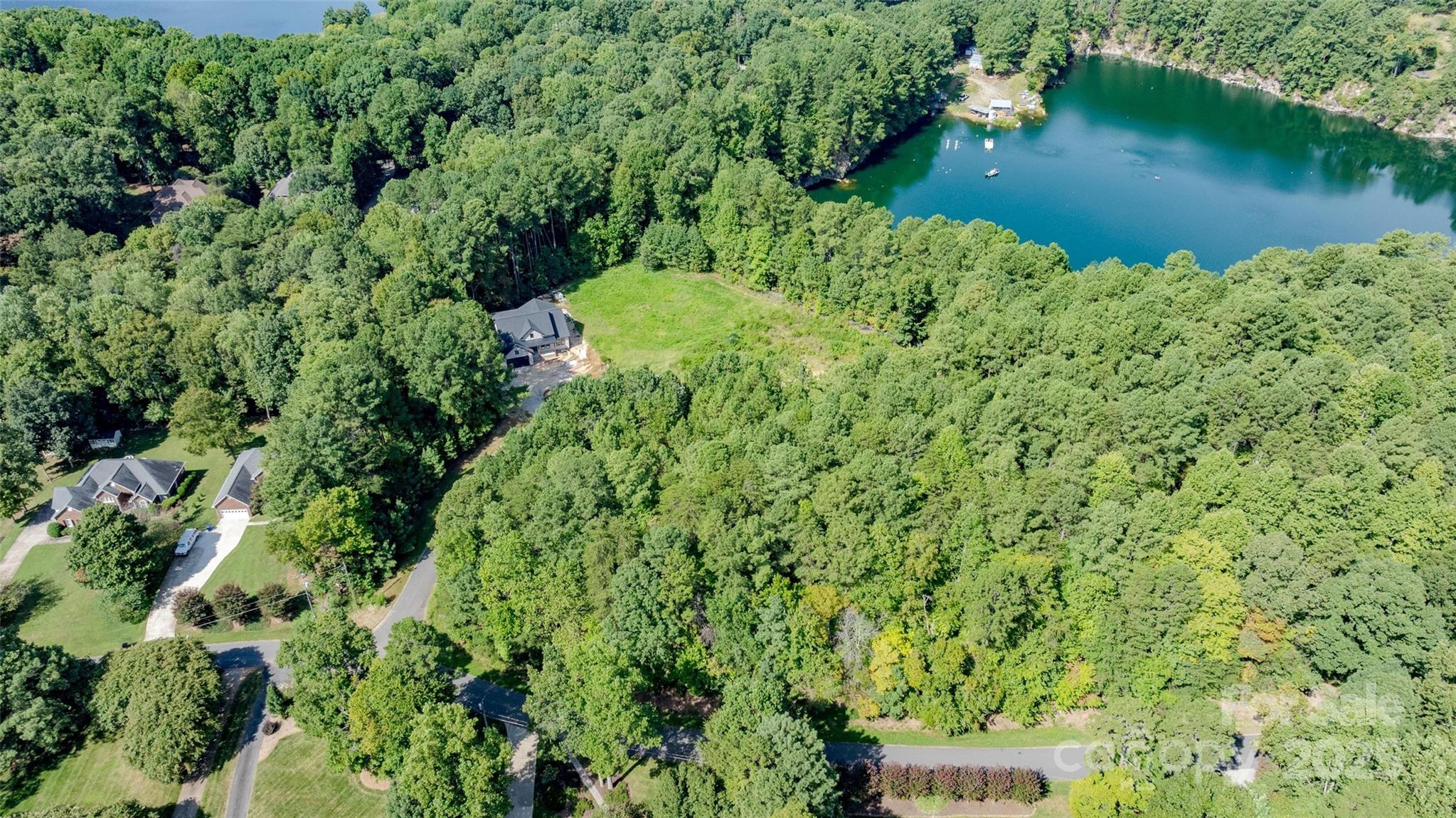 122 Ridgetop Road, Unit 4 Mooresville, NC 28117 - Photo 2 of 11 an aerial view of a house with a yard and lake view