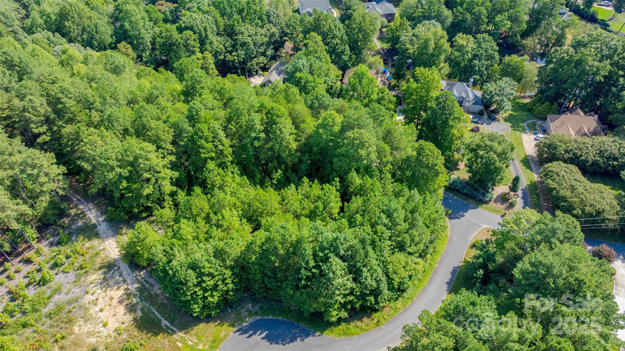 122 Ridgetop Road, Unit 4 Mooresville, NC 28117 - Photo 4 of 11 an aerial view of residential house with outdoor space and trees all around